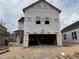 Exterior view of a two-story home under construction showing the garage with open framing at 2872 Quarry Rd # 166, Rolesville, NC 27571