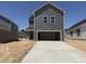 New construction home with a two car garage and concrete driveway at 2872 Quarry Rd # 166, Rolesville, NC 27571