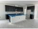 Bright new kitchen with navy cabinets and island, awaiting finishing touches at 2872 Quarry Rd # 166, Rolesville, NC 27571
