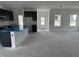 Spacious kitchen area featuring dark cabinets, a center island and large open space at 2872 Quarry Rd # 166, Rolesville, NC 27571