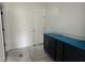 Stylish kitchenette area featuring sleek black cabinets and a convenient door for easy access at 2872 Quarry Rd # 166, Rolesville, NC 27571