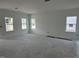 Spacious living room with three windows, offering ample natural light in a new home at 2872 Quarry Rd # 166, Rolesville, NC 27571