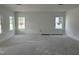 Bright living room with two windows, offering ample natural light in a new home at 2872 Quarry Rd # 166, Rolesville, NC 27571