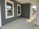 View of porch featuring gray siding, white trim and pillars at 2872 Quarry Rd # 166, Rolesville, NC 27571