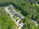 Aerial view of a beautiful, tree-lined neighborhood with well-maintained lawns and spacious homes at 2993 Club Dr, Raleigh, NC 27613
