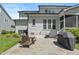 Outdoor seating area with grill and patio in a serene backyard setting at 2993 Club Dr, Raleigh, NC 27613