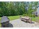 Spacious backyard with patio, grill, and lush greenery, perfect for outdoor living at 2993 Club Dr, Raleigh, NC 27613