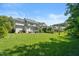 Lush green backyard with patio and potential for outdoor activities at 2993 Club Dr, Raleigh, NC 27613