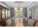 Bright dining room with hardwood floors, a large table, and plenty of natural light at 2993 Club Dr, Raleigh, NC 27613