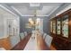 Bright dining room with hardwood floors, a large table, and plenty of natural light at 2993 Club Dr, Raleigh, NC 27613