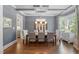 Elegant dining room with coffered ceiling, stylish chandelier, and ample seating at 2993 Club Dr, Raleigh, NC 27613