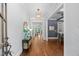 Inviting entryway featuring hardwood floors, elegant lighting, and stylish decor at 2993 Club Dr, Raleigh, NC 27613