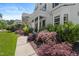 Home's exterior features manicured landscaping and a covered porch with columns at 2993 Club Dr, Raleigh, NC 27613
