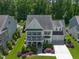 Charming two-story home with a well-manicured lawn, inviting front porch, and a spacious two-car garage at 2993 Club Dr, Raleigh, NC 27613