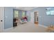 Game room with a blue accent wall and entertainment center at 2993 Club Dr, Raleigh, NC 27613
