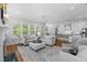 Open concept living room with hardwood floors, natural light, and fireplace at 2993 Club Dr, Raleigh, NC 27613
