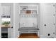 Charming mudroom with bench seating, storage cubbies, and hooks, perfect for organizing outdoor gear and accessories at 2993 Club Dr, Raleigh, NC 27613