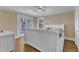 Sunlit bedroom with French doors, hardwood floors and white trim around the windows and doors at 300 S Pine St, Benson, NC 27504