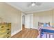 Comfortable bedroom featuring hardwood floors, large closet, and neutral walls at 300 S Pine St, Benson, NC 27504