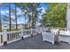 Spacious deck with white railings and outdoor seating area at 300 S Pine St, Benson, NC 27504