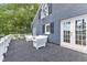 Exterior view of deck with white furniture and access to the house at 300 S Pine St, Benson, NC 27504