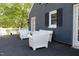 View of the deck with chairs and white railing at 300 S Pine St, Benson, NC 27504
