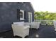 View of the deck with chairs and white railing at 300 S Pine St, Benson, NC 27504