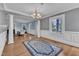 Bright entryway featuring hardwood floors, decorative rug, and a decorative door at 300 S Pine St, Benson, NC 27504