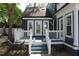 Covered porch with double glass doors at 300 S Pine St, Benson, NC 27504