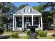 Charming two-story home with a covered porch and landscaped front yard at 300 S Pine St, Benson, NC 27504