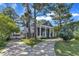 Elegant two-story home with circle driveway, and a lush, green lawn at 300 S Pine St, Benson, NC 27504