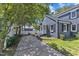 This cozy, beautifully maintained cottage includes a well-tended garden at 300 S Pine St, Benson, NC 27504