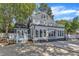 Home exterior showcasing a two-story deck and well-manicured yard at 300 S Pine St, Benson, NC 27504