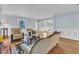 Cozy living room featuring hardwood floors, comfortable seating and natural light at 300 S Pine St, Benson, NC 27504