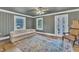 Inviting living room with hardwood floors, a comfortable sofa, and natural light at 300 S Pine St, Benson, NC 27504