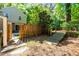 Cozy backyard featuring a quaint wooden ramp and a private fence creating a serene outdoor space at 3029 Wycliff Rd, Raleigh, NC 27607