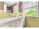 Bathroom with vanity, large mirror, and cabinet storage at 3029 Wycliff Rd, Raleigh, NC 27607