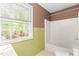 Bathroom with tiled walls and a shower/tub combo at 3029 Wycliff Rd, Raleigh, NC 27607