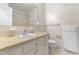 Tiled bathroom featuring a single sink vanity, toilet, and a shower with a curtain at 3029 Wycliff Rd, Raleigh, NC 27607