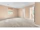Expansive primary bedroom with neutral carpet, closet, and view of a window at 3029 Wycliff Rd, Raleigh, NC 27607