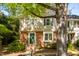 Traditional townhouse with brick facade, light siding, green shutters, and a cozy front entrance at 3029 Wycliff Rd, Raleigh, NC 27607