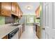 Traditional style kitchen with wooden cabinets, standard appliances, and practical design elements at 3029 Wycliff Rd, Raleigh, NC 27607