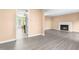 Spacious living room features a fireplace, modern floors, and an open doorway to the kitchen at 3029 Wycliff Rd, Raleigh, NC 27607