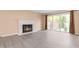 Inviting living room featuring a classic fireplace, with sliding doors providing access to the outdoors at 3029 Wycliff Rd, Raleigh, NC 27607