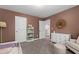 bedroom featuring a bookshelf and large window at 303 Forestview Crest Way, Fuquay Varina, NC 27526