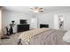 Spacious bedroom with walk-in closet, ceiling fan, and workout bike at 303 Forestview Crest Way, Fuquay Varina, NC 27526