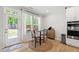 Bright dining area featuring a round table, natural light, and a view of the backyard at 303 Forestview Crest Way, Fuquay Varina, NC 27526