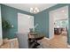 Well-lit dining room featuring a round table, hardwood floors, and a modern chandelier at 303 Forestview Crest Way, Fuquay Varina, NC 27526