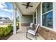 Cozy covered porch with seating, perfect for relaxing and enjoying the neighborhood view at 303 Forestview Crest Way, Fuquay Varina, NC 27526