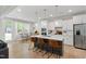 Modern kitchen with a large center island, stainless steel appliances, and ample cabinet space at 303 Forestview Crest Way, Fuquay Varina, NC 27526